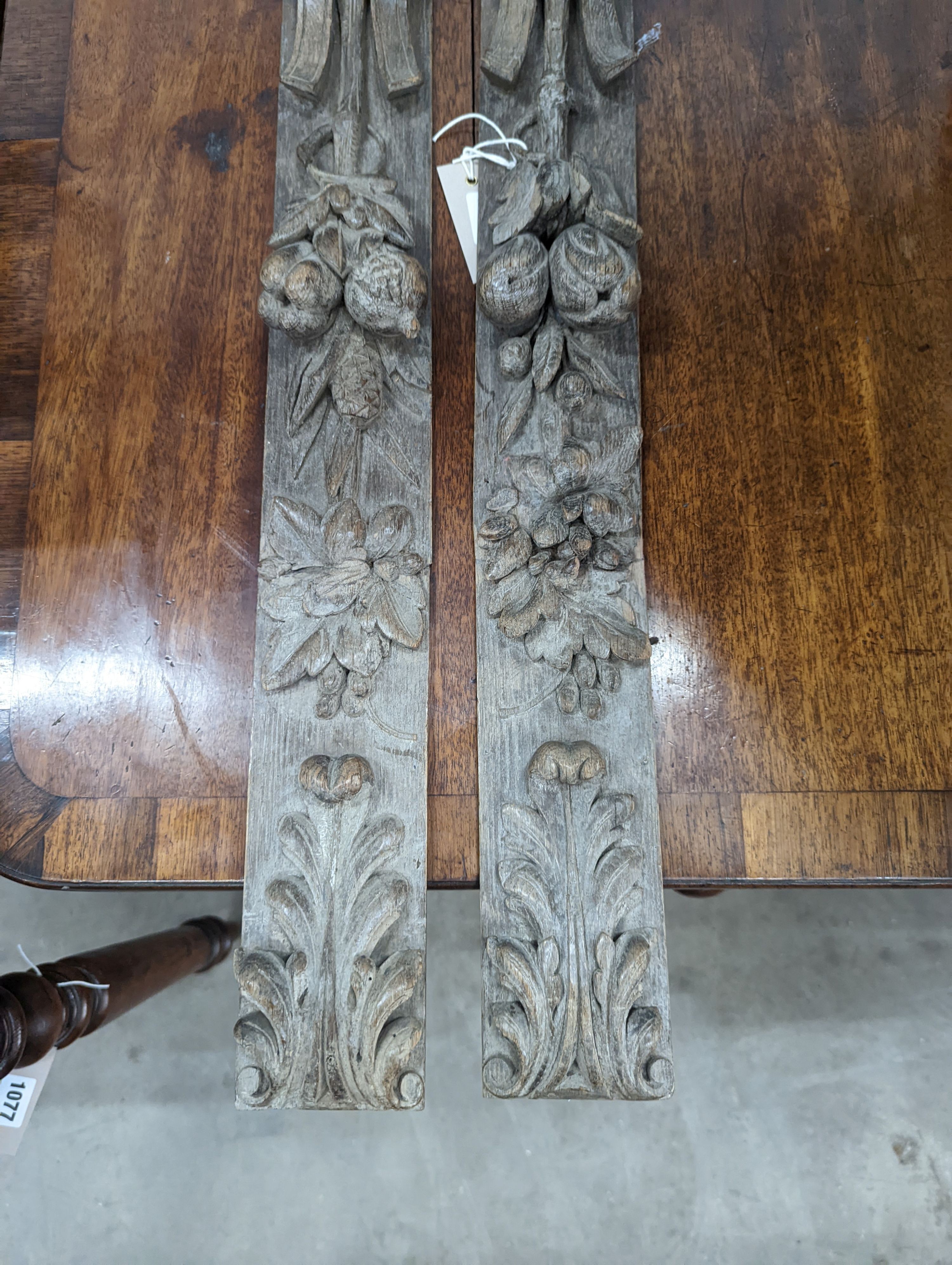 A pair of 19th century carved oak appliques, height 80cm